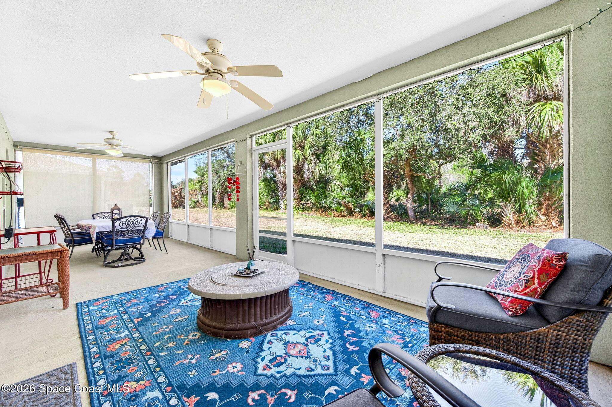 2186 Spring Creek Circle Palm Bay, FL 32905 - Photo 34 of 40 a living room with furniture and a large window