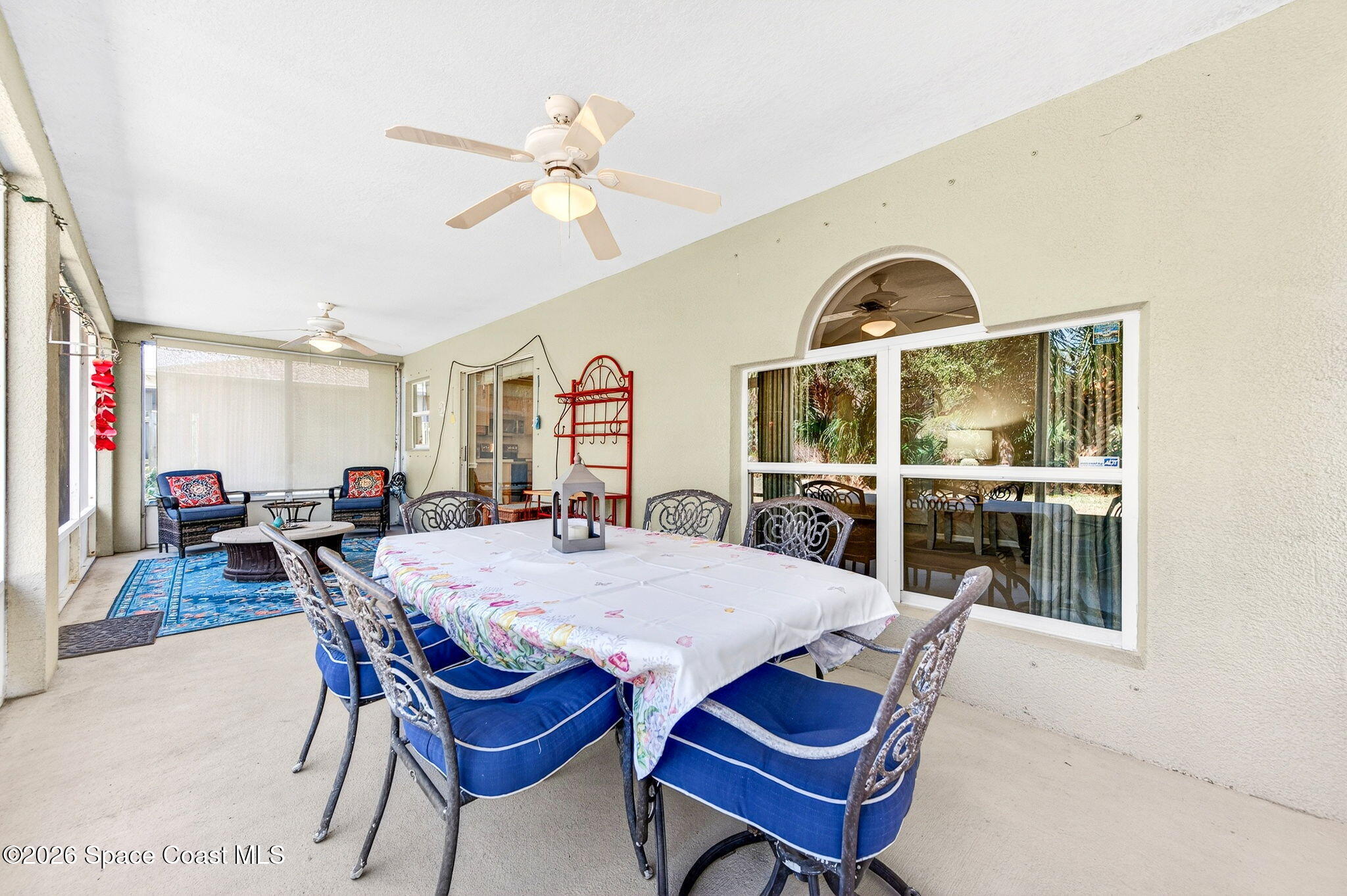 2186 Spring Creek Circle Palm Bay, FL 32905 - Photo 35 of 40 a view of a dining room with furniture and a chandelier