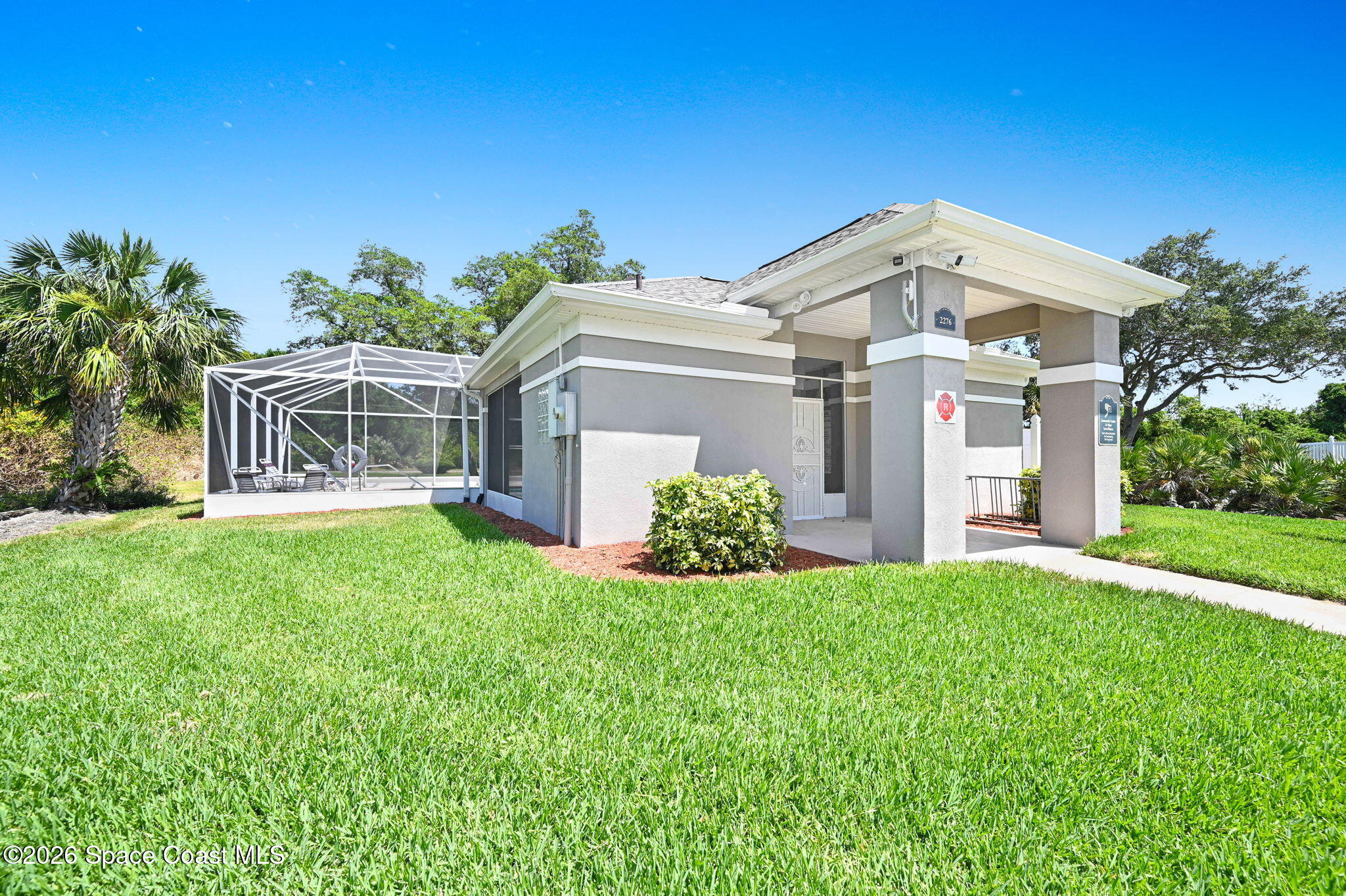 2186 Spring Creek Circle Palm Bay, FL 32905 - Photo 36 of 40 front view of a house with a yard