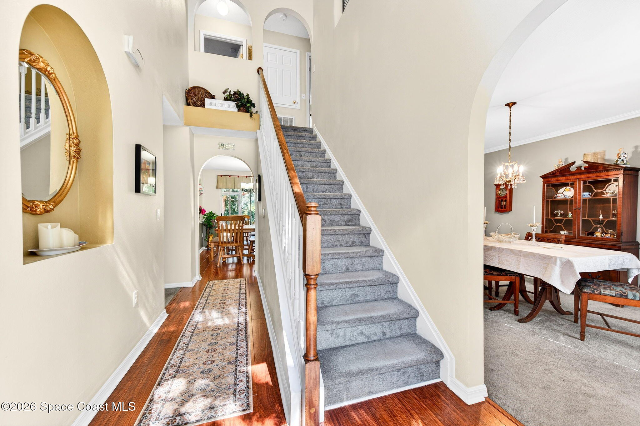 2186 Spring Creek Circle Palm Bay, FL 32905 - Photo 6 of 40 a view of entryway and hall with wooden floor