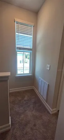 a view of room with window and hardwood floor