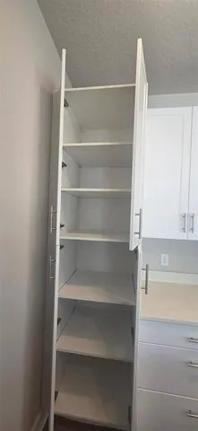 a stove top oven sitting inside of a kitchen