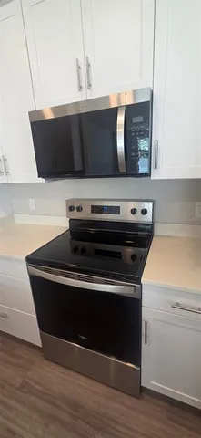 a bathroom with a double vanity sink and mirror
