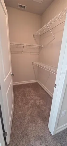 a view of a room with racks on the wall