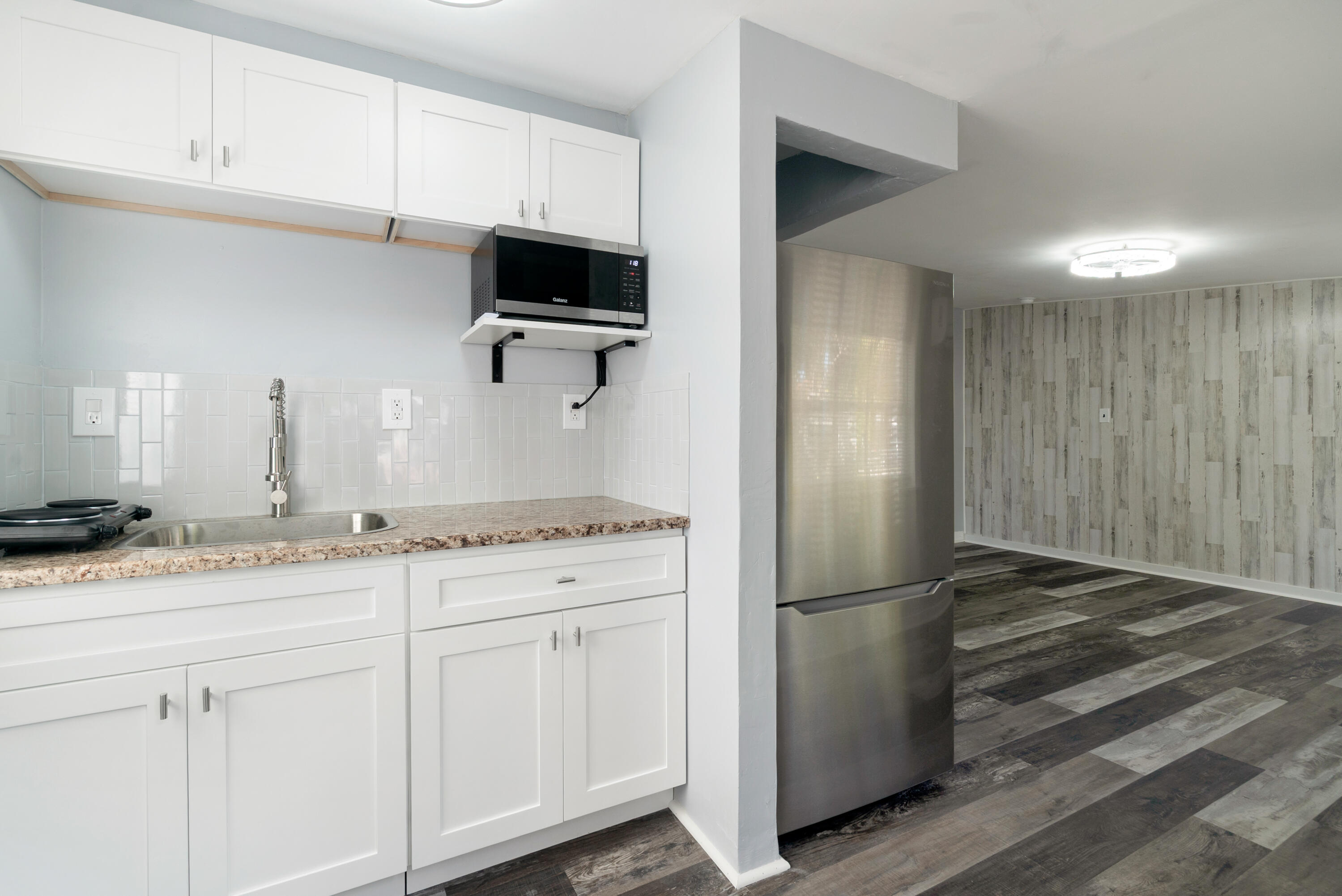 271 Ryan Avenue Key Largo, FL 33037 - Photo 23 of 58 a kitchen with granite countertop stainless steel appliances a refrigerator and cabinets