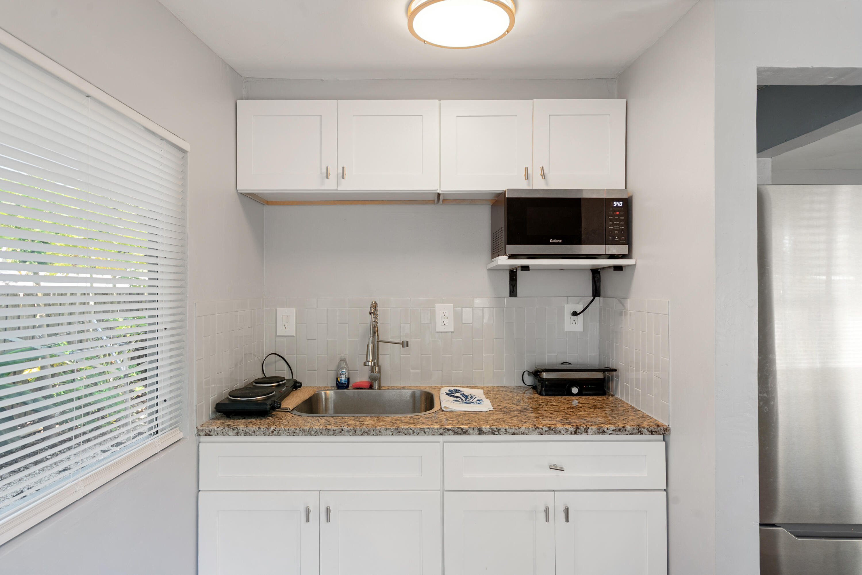 271 Ryan Avenue Key Largo, FL 33037 - Photo 32 of 58 a kitchen with a sink and cabinets