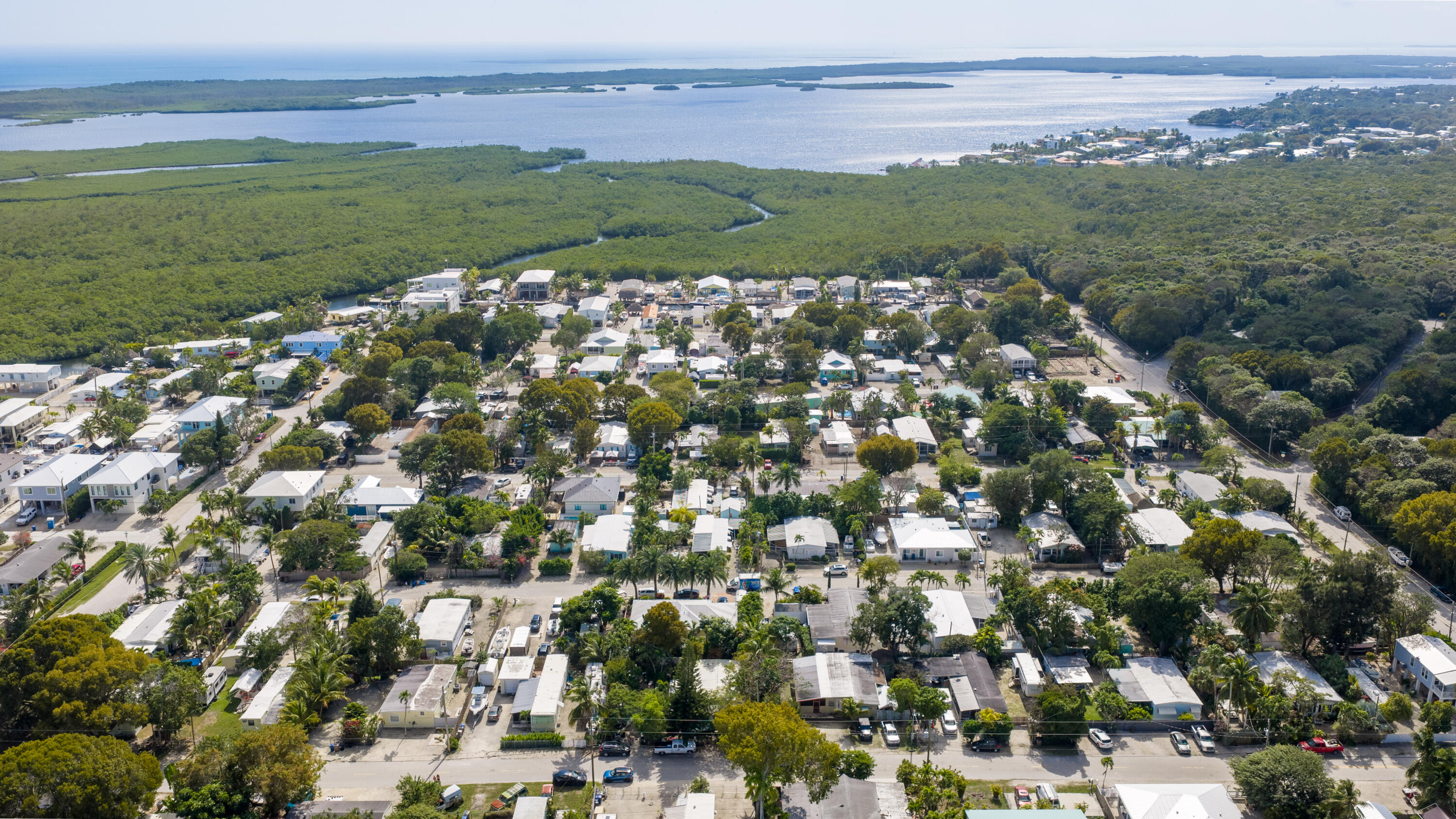 271 Ryan Avenue Key Largo, FL 33037 - Photo 47 of 58 a view of a field with an ocean and trees