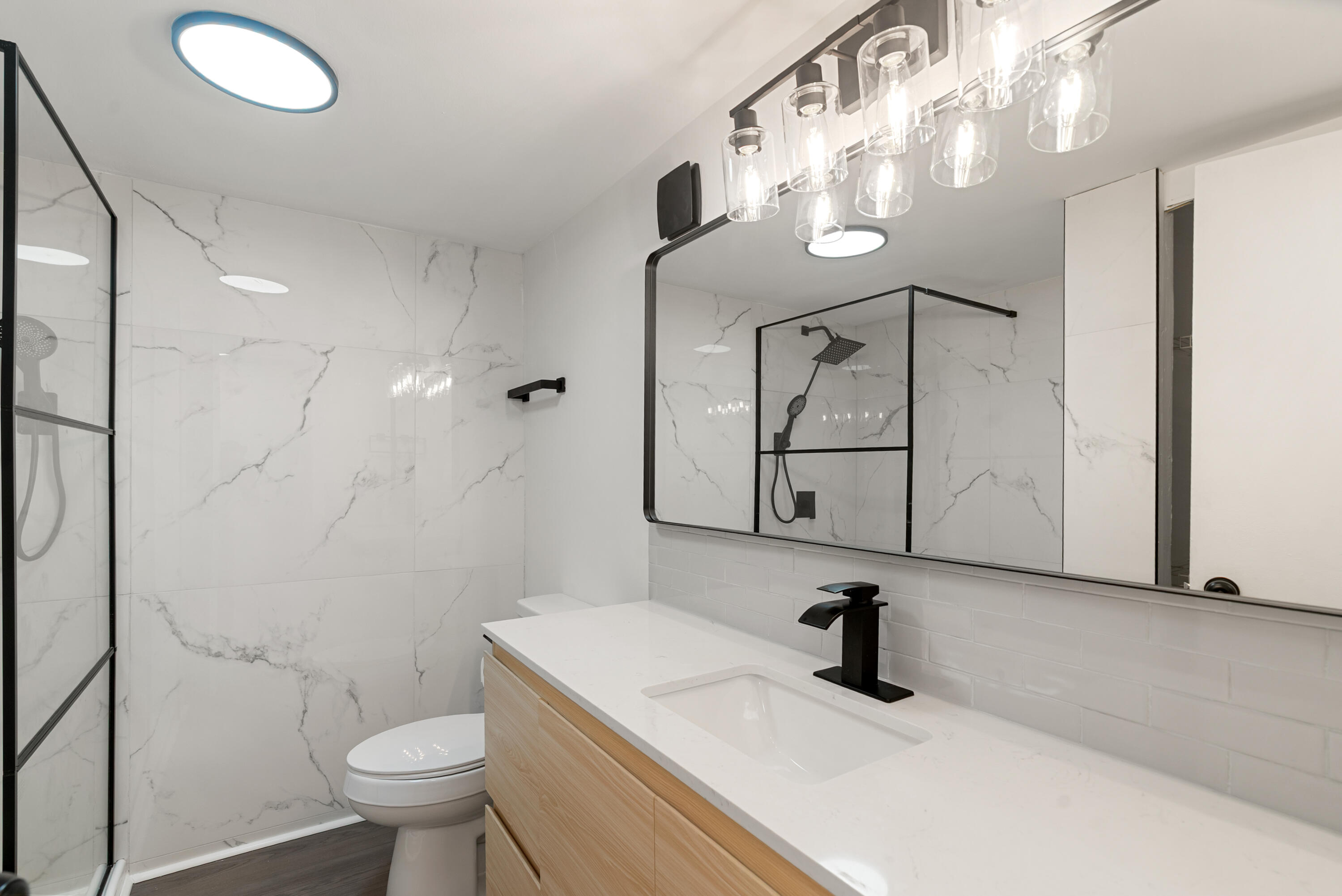 271 Ryan Avenue Key Largo, FL 33037 - Photo 7 of 58 a bathroom with a sink a toilet and a mirror