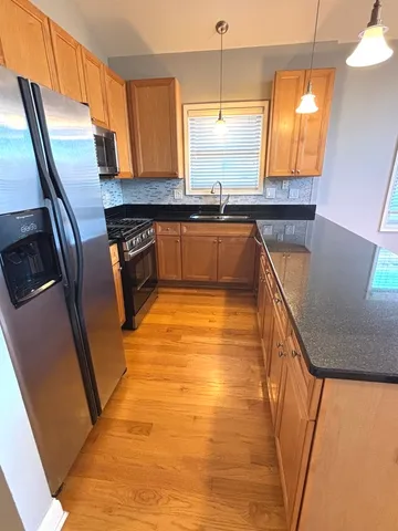 a bathroom with a sink a mirror and a shower