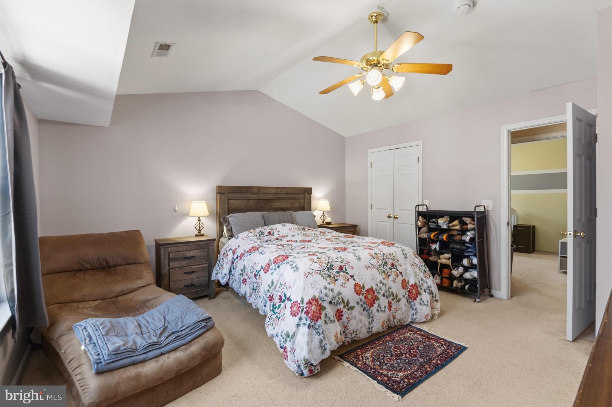 9279 Inaugural Drive King George, VA 22485 - Photo 15 of 30 a bedroom with bed and a chandelier