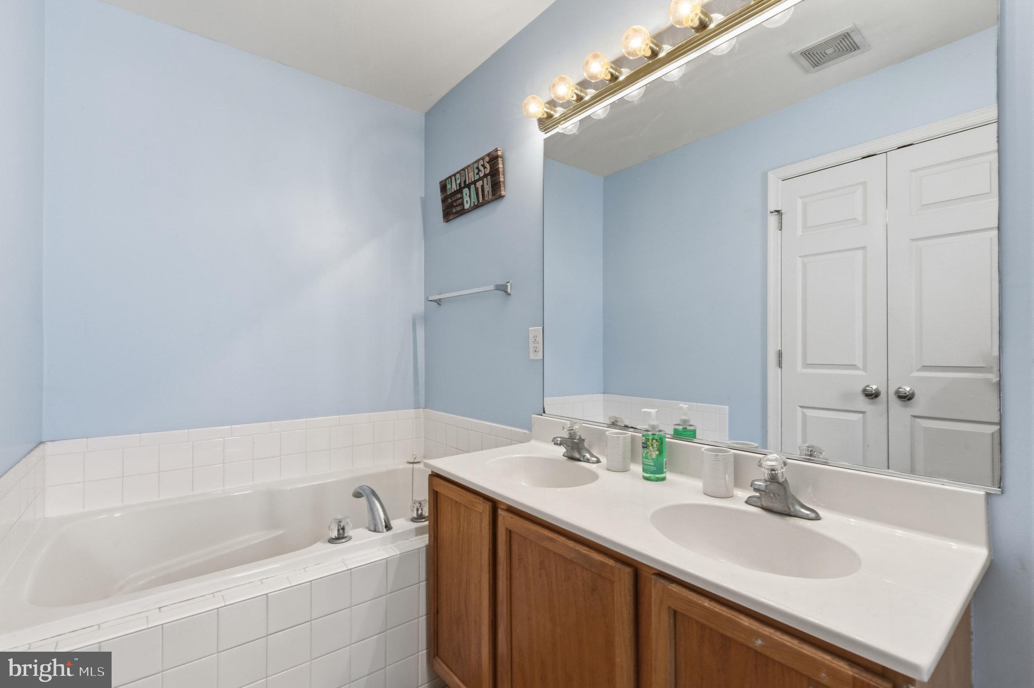 9279 Inaugural Drive King George, VA 22485 - Photo 18 of 30 a bathroom with a sink and a bathtub