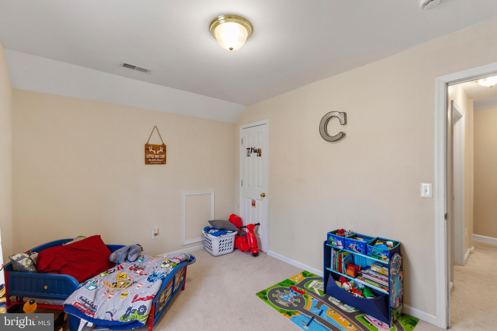 9279 Inaugural Drive King George, VA 22485 - Photo 22 of 30 a bedroom with toys and a couch