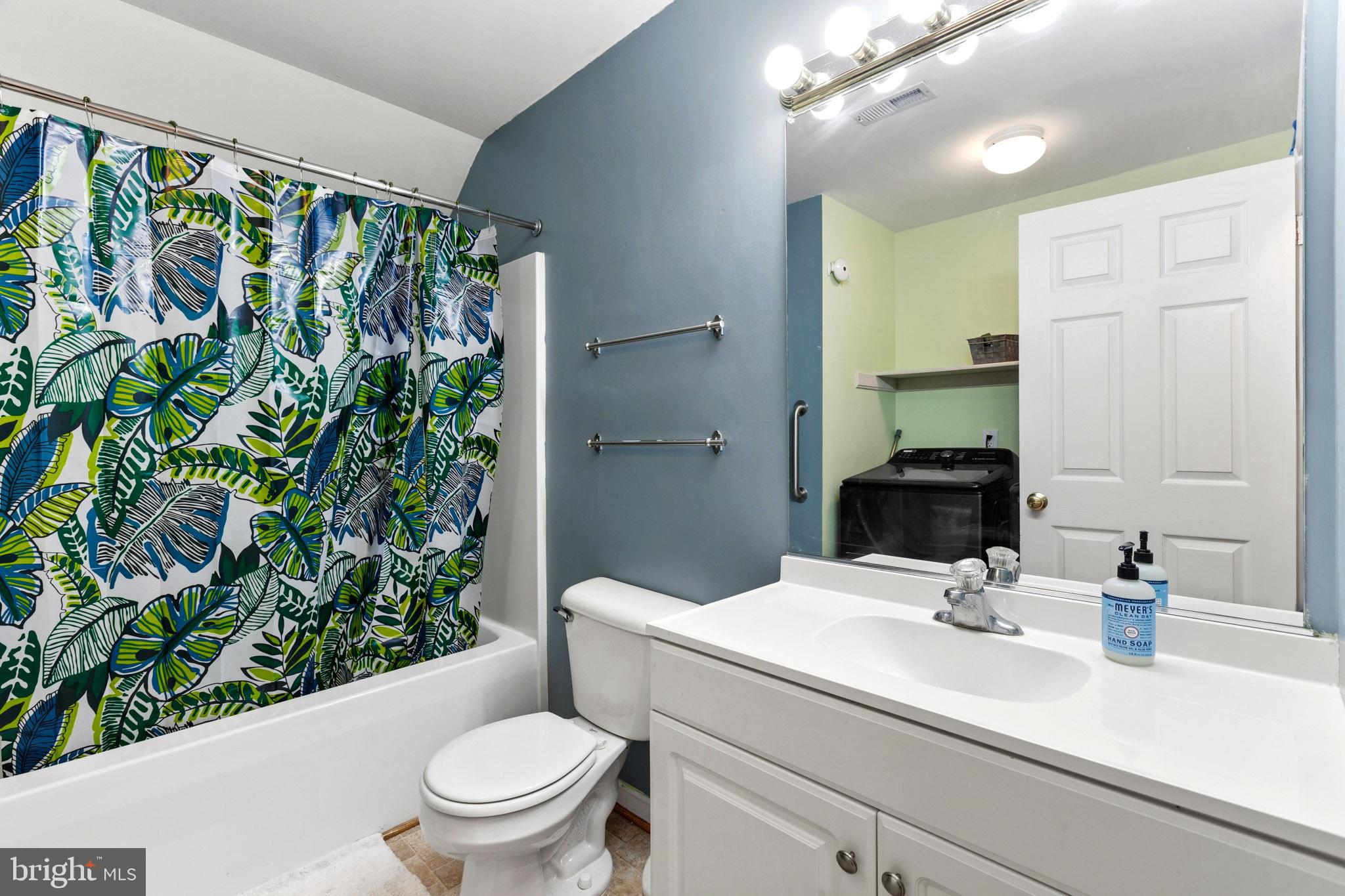 9279 Inaugural Drive King George, VA 22485 - Photo 23 of 30 a bathroom with a sink a toilet and a mirror
