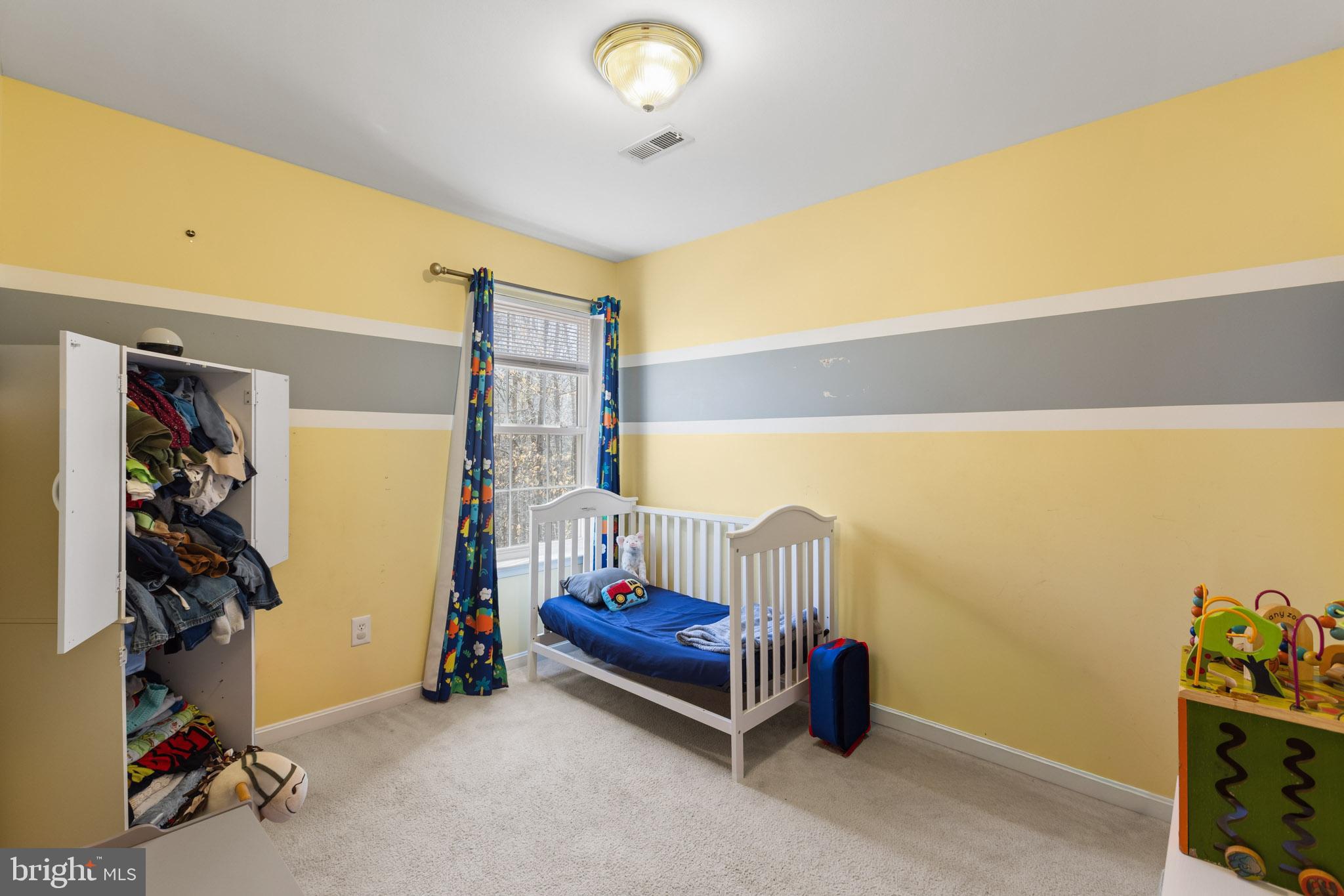 9279 Inaugural Drive King George, VA 22485 - Photo 25 of 30 a bedroom with furniture and a ceiling fan