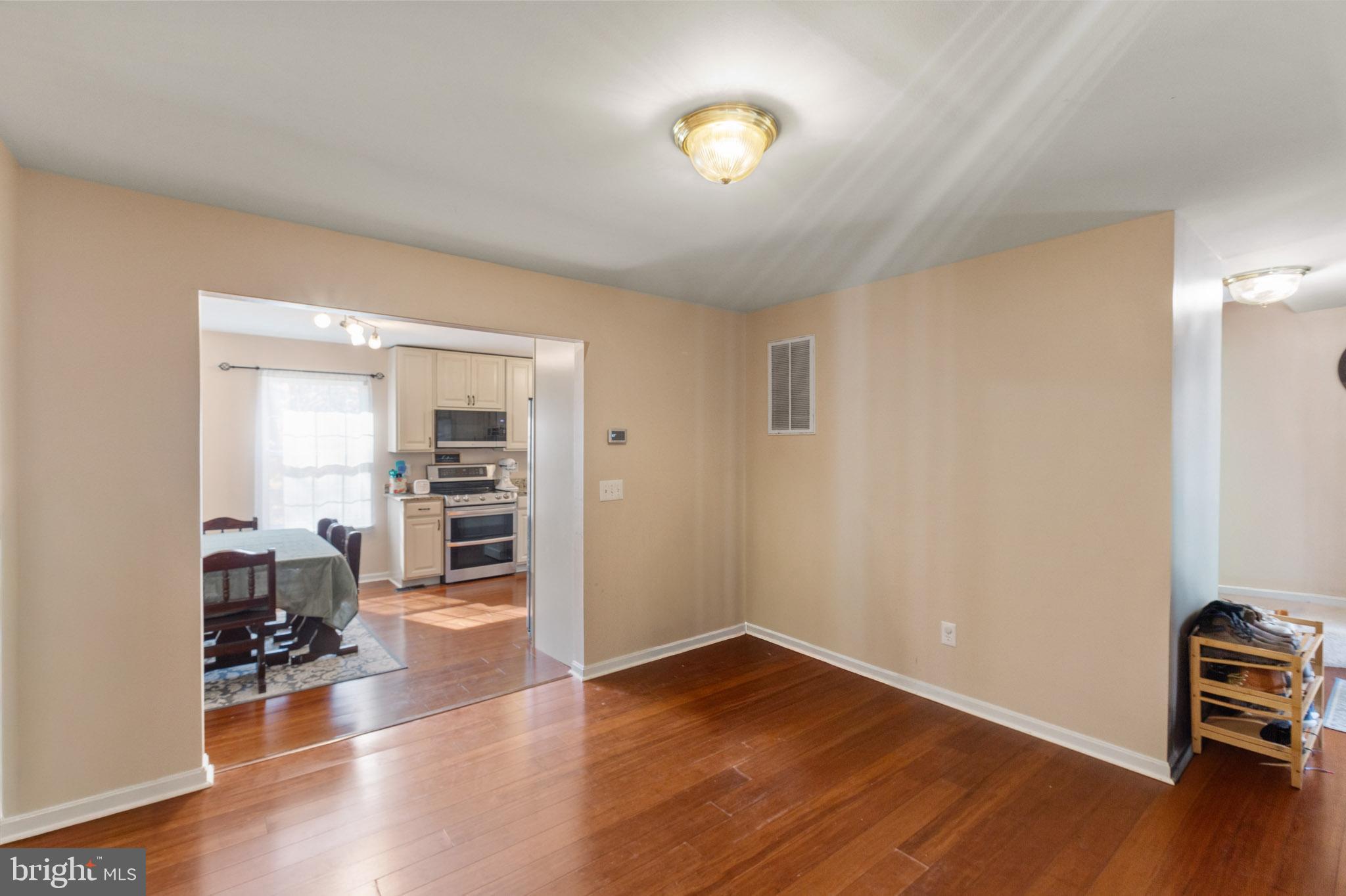 9279 Inaugural Drive King George, VA 22485 - Photo 6 of 30 a view of a livingroom with furniture and hardwood floor