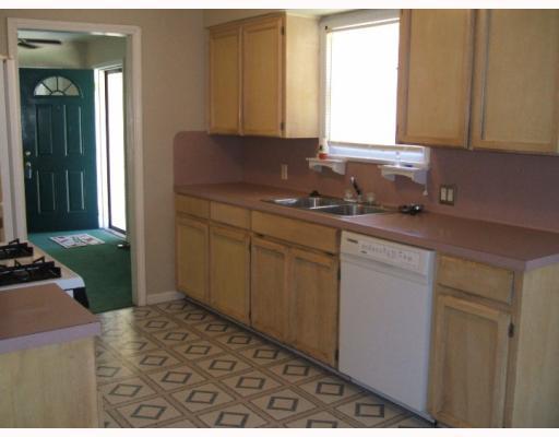 3258 Austin Street Corpus Christi, TX 78404 - Photo 2 of 3 a kitchen with a sink cabinets and a stove