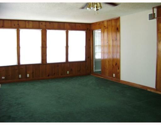3258 Austin Street Corpus Christi, TX 78404 - Photo 3 of 3 a view of an empty room with a window and hardwood floor