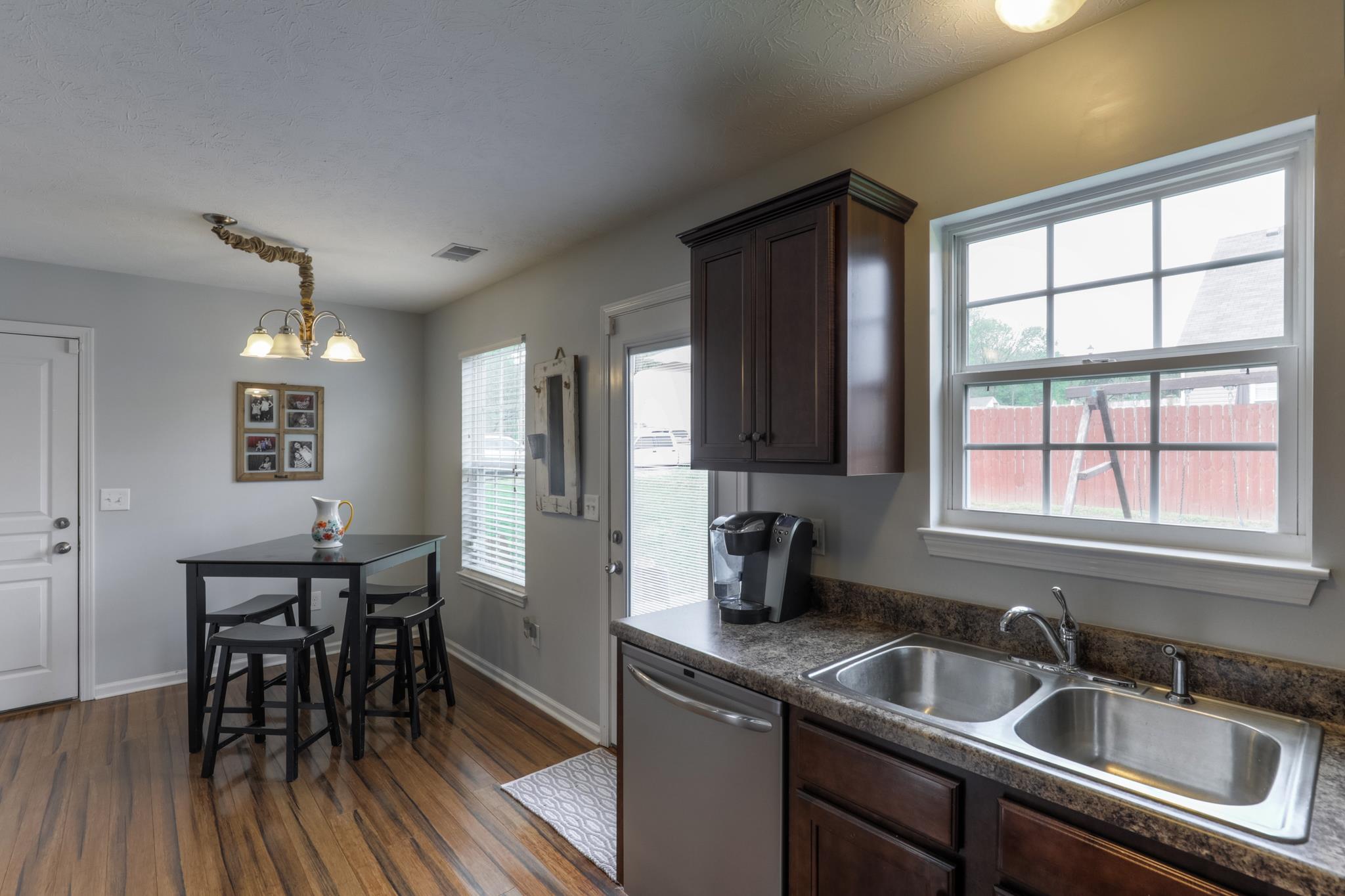 1118 Woodall Road Lebanon, TN 37090 - Photo 14 of 25 a kitchen that has a sink and a wooden floor