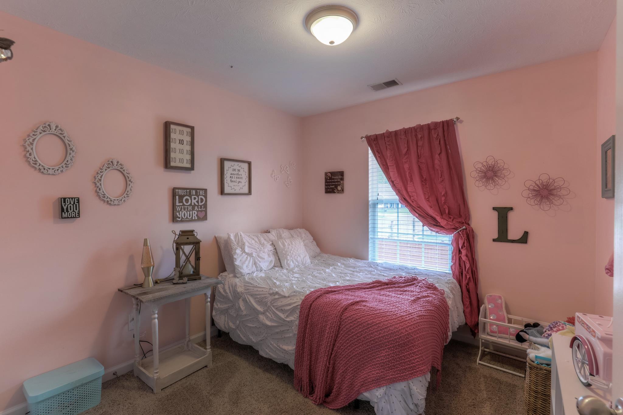 1118 Woodall Road Lebanon, TN 37090 - Photo 18 of 25 a bedroom with a bed and wooden floor