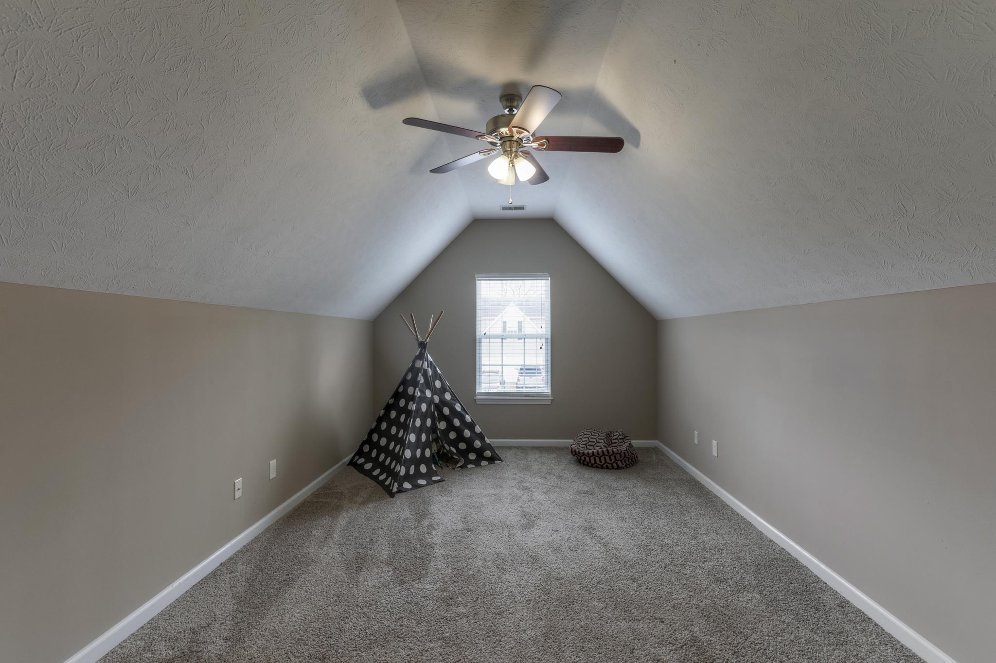 1118 Woodall Road Lebanon, TN 37090 - Photo 21 of 25 an empty room with a window and a fan