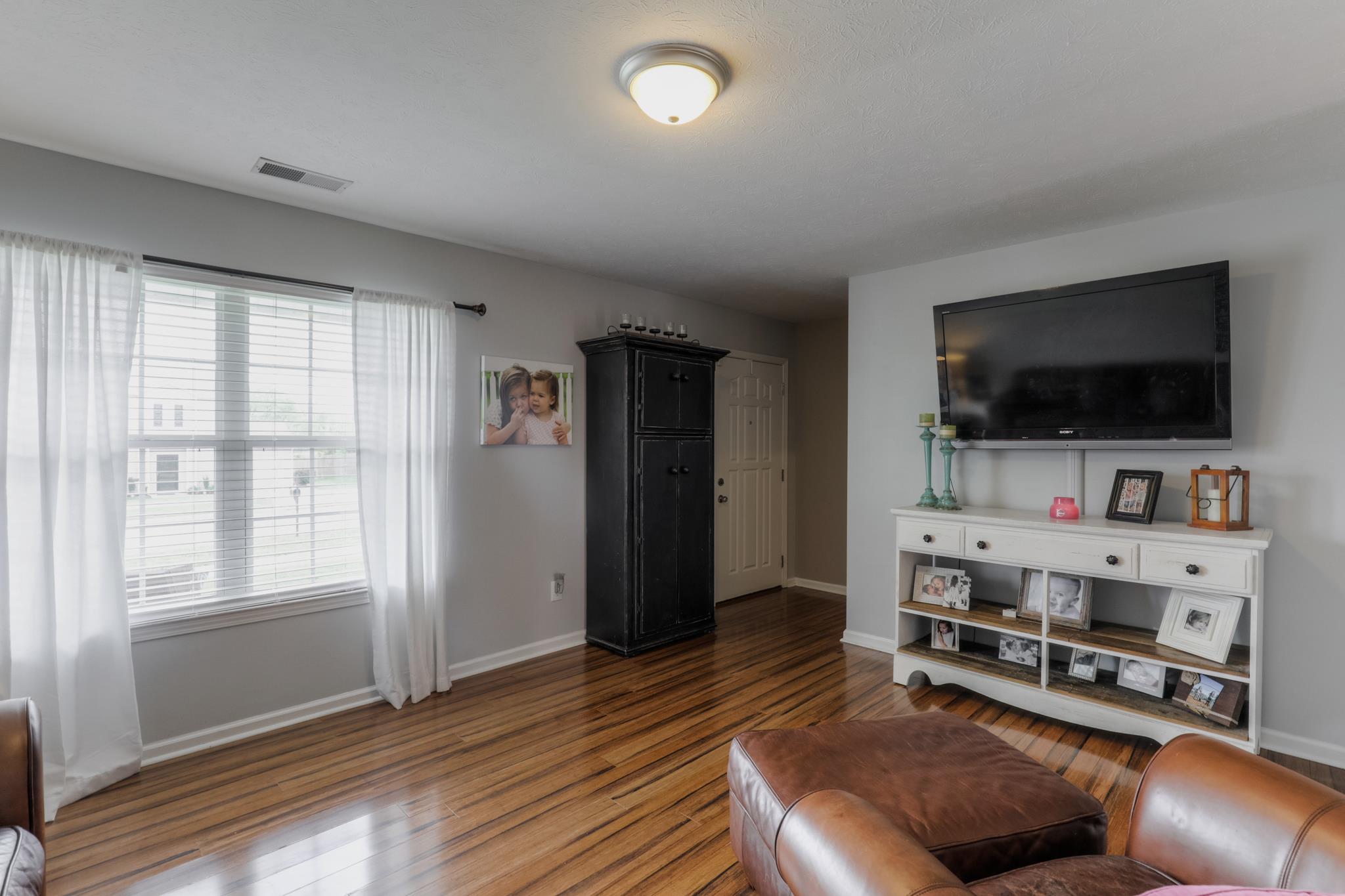1118 Woodall Road Lebanon, TN 37090 - Photo 6 of 25 a living room with furniture and a flat screen tv