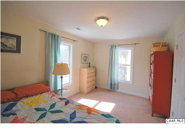 112 Roy's Place Charlottesville, VA 22902 - Photo 11 of 14 a living room with a bed furniture and a window