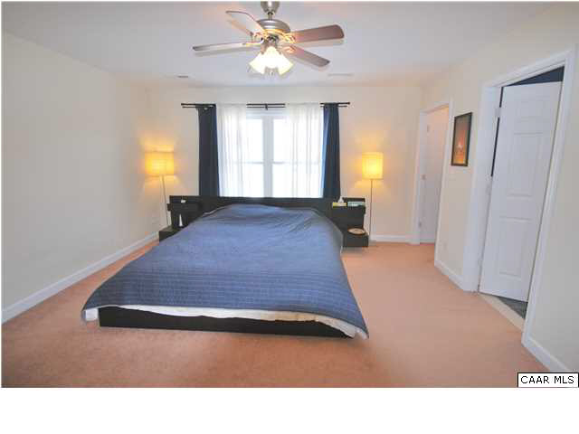 112 Roy's Place Charlottesville, VA 22902 - Photo 8 of 14 a living room with a bed furniture and a window