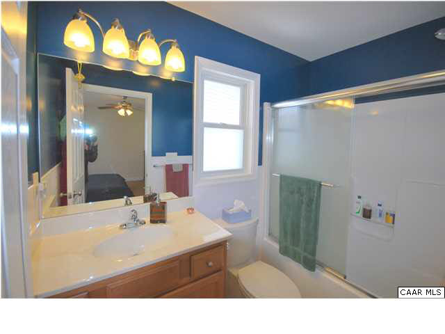 112 Roy's Place Charlottesville, VA 22902 - Photo 9 of 14 a bathroom with a sink vanity and a mirror