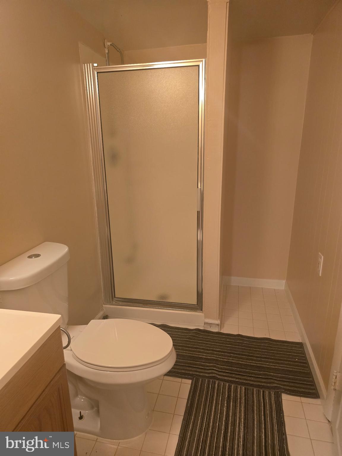 5901 Sunset Avenue Baltimore, MD 21207 - Photo 12 of 13 a bathroom with a toilet and a shower