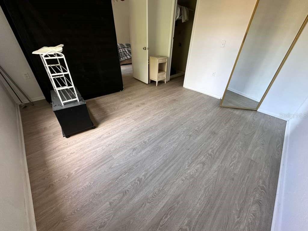 5283 Images Circle, Unit 304 Kissimmee, FL 34746 - Photo 2 of 2 wooden floor with an entryway