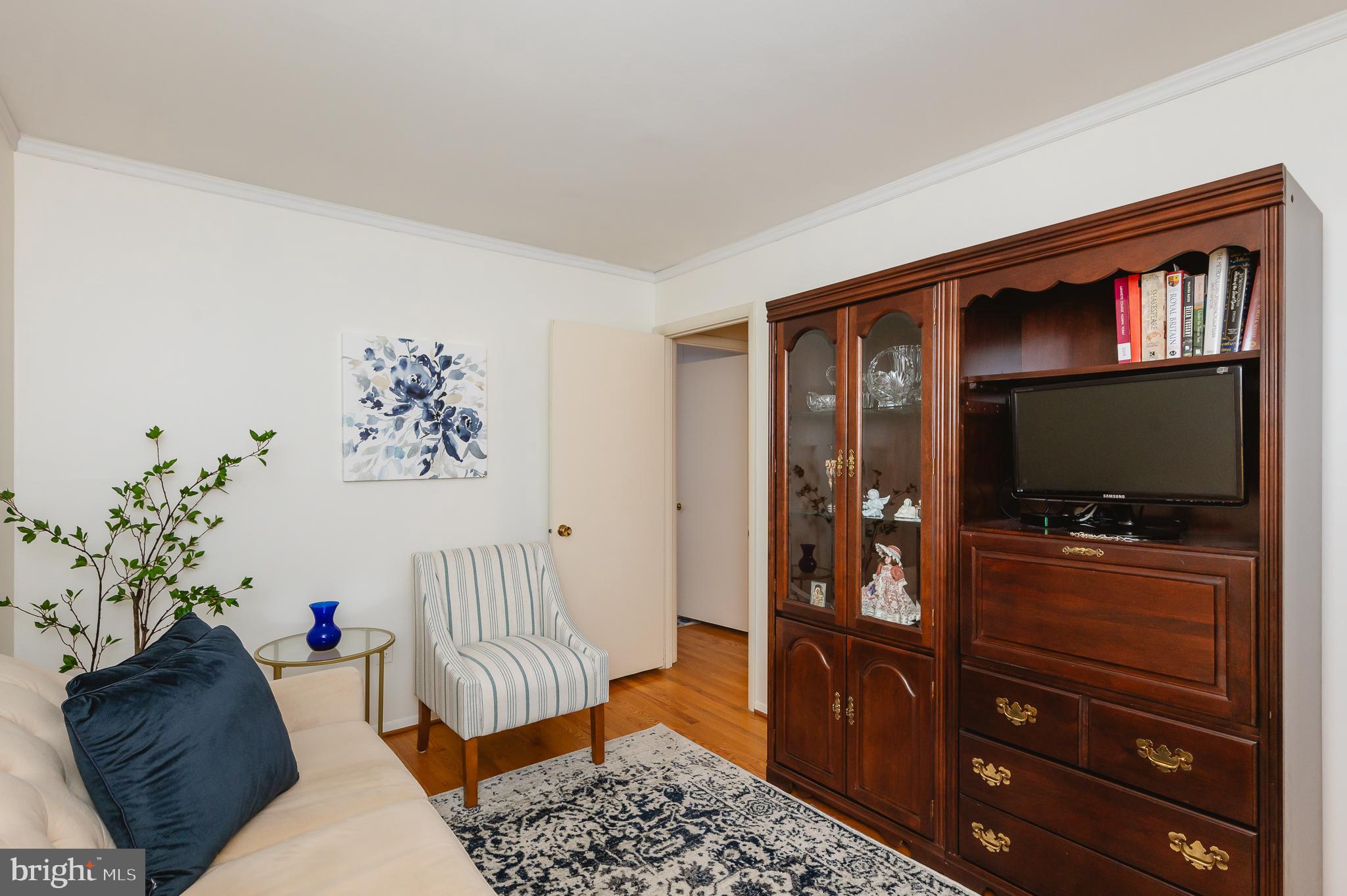 8337 Analee Avenue Rosedale, MD 21237 - Photo 15 of 48 a living room with furniture and a flat screen tv