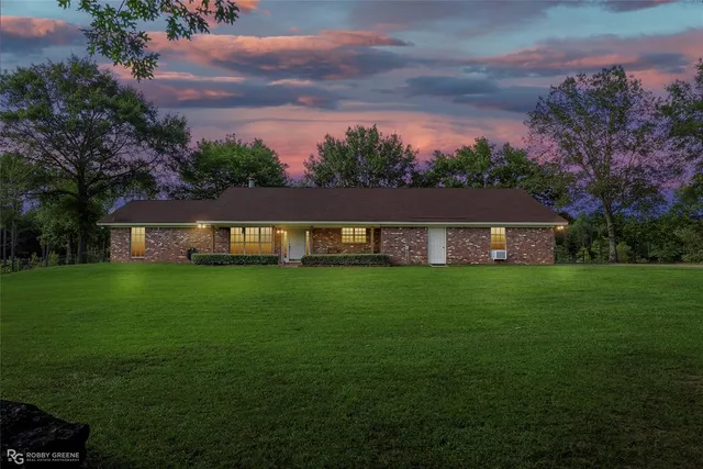 a view of a house with a big yard