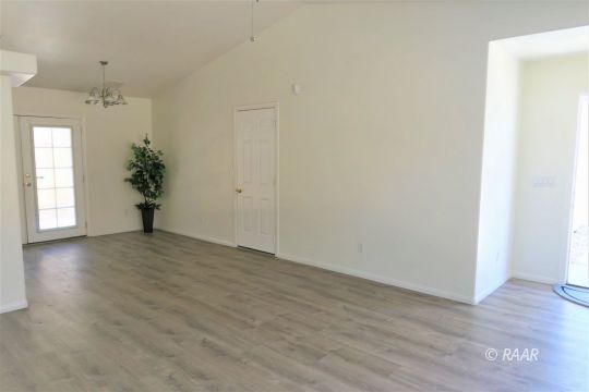 1420 South Yorktown Street Ridgecrest, CA 93555 - Photo 6 of 27 a view of a room with wooden floor and window