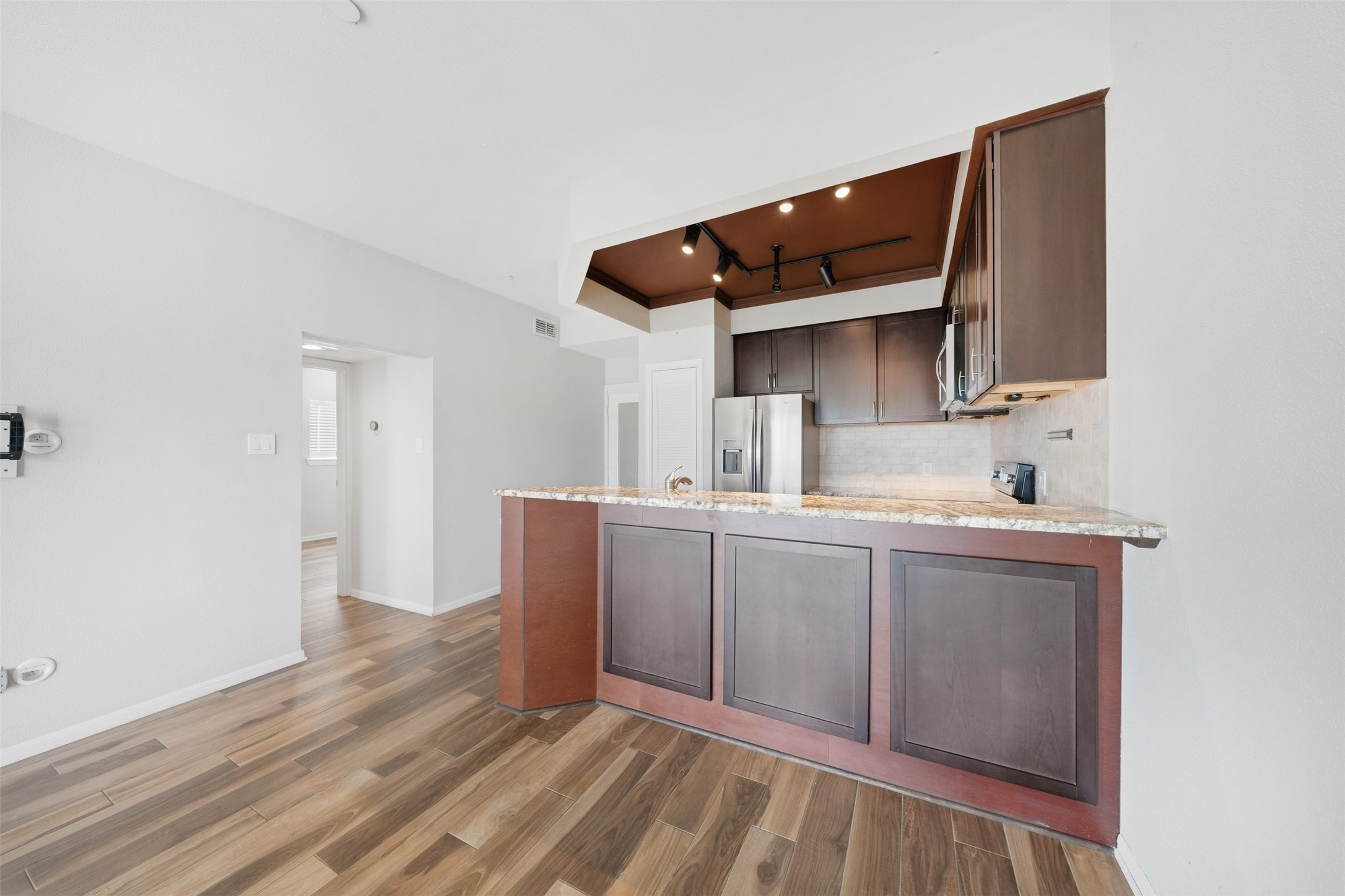 793 Davis Road, Unit 116 League City, TX 77573 - Photo 11 of 31 a kitchen with stainless steel appliances granite countertop a sink and cabinets