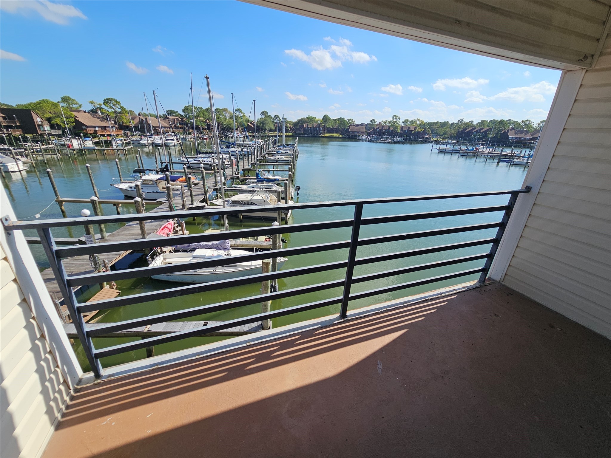 793 Davis Road, Unit 116 League City, TX 77573 - Photo 2 of 31 a view of a lake from a balcony