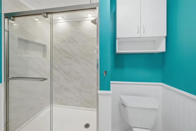 a bathroom with a bathtub and a shower