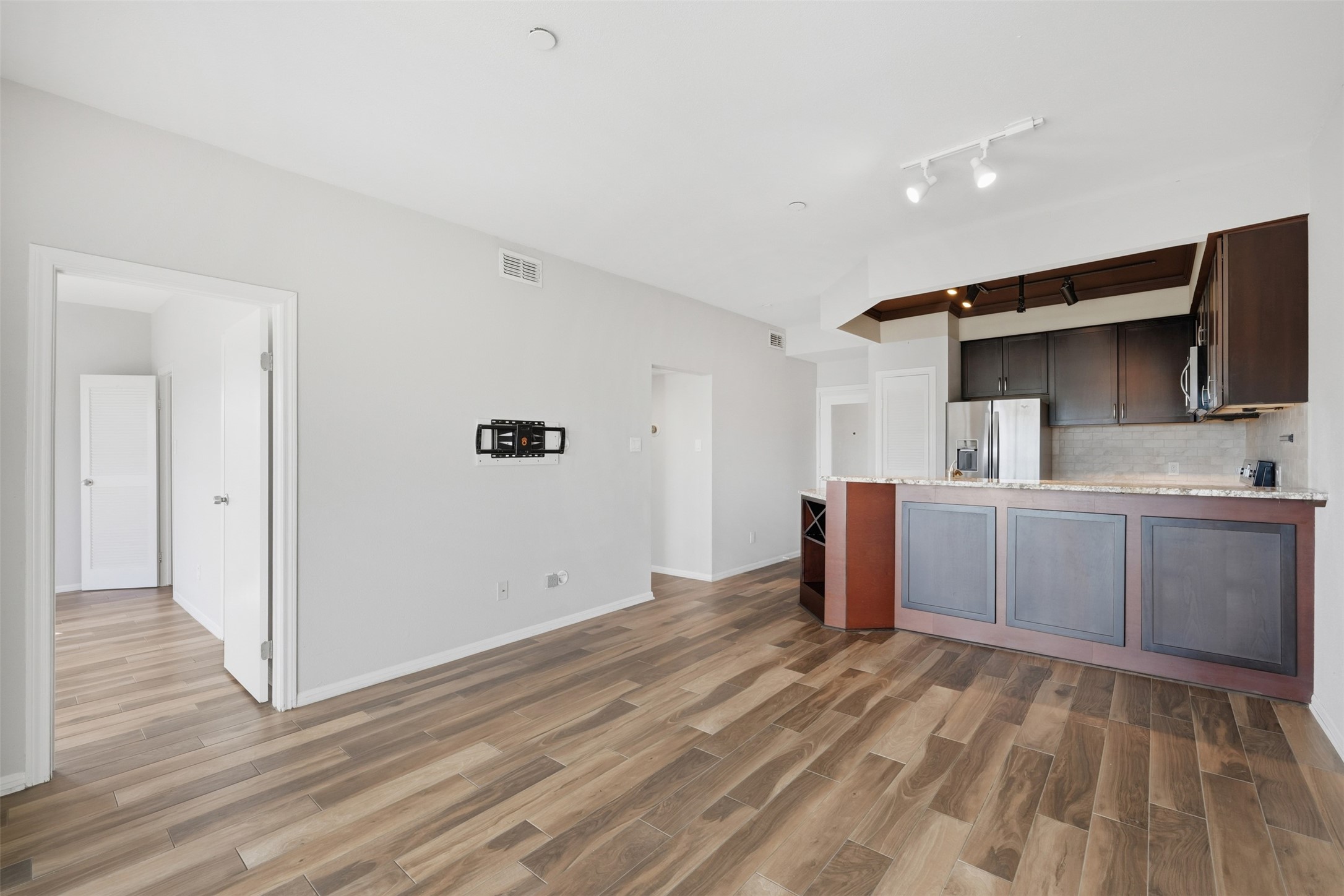 793 Davis Road, Unit 116 League City, TX 77573 - Photo 6 of 31 a kitchen with a sink and wooden floor