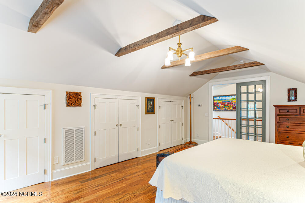 180 North Ridge Street Southern Pines, NC 28387 - Photo 62 of 72 Exposed beams and built-in closets.