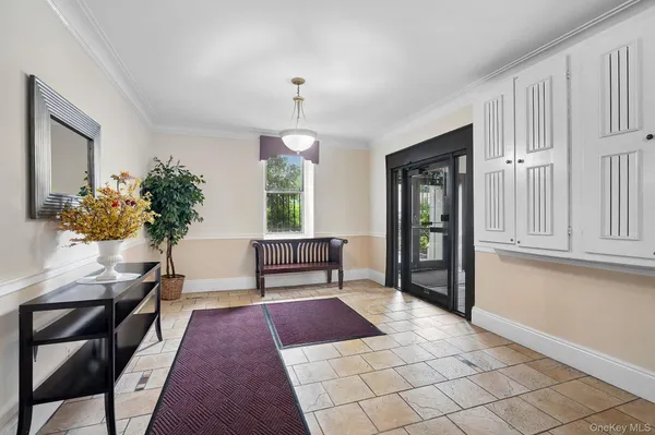 a bedroom with furniture and a rug