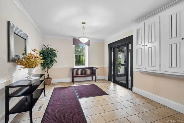 a bedroom with furniture and a rug