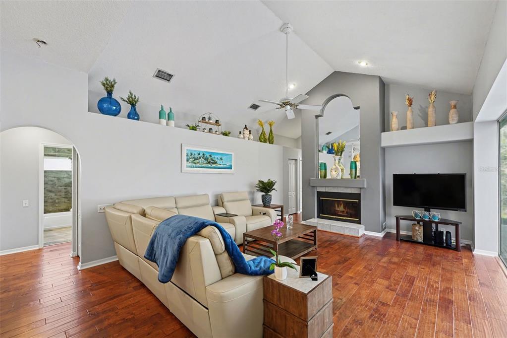 4491 Fallbrook Boulevard Palm Harbor, FL 34685 - Photo 18 of 46 a living room with furniture and a flat screen tv