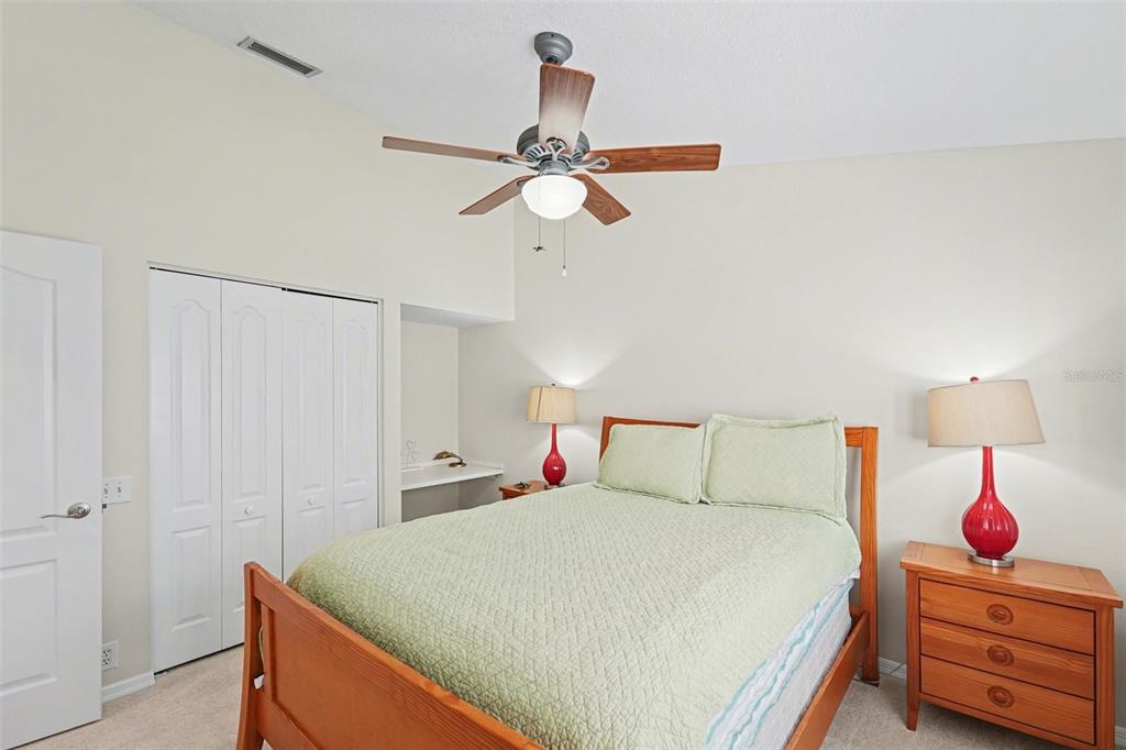 4491 Fallbrook Boulevard Palm Harbor, FL 34685 - Photo 21 of 46 a bedroom with a bed and a closet
