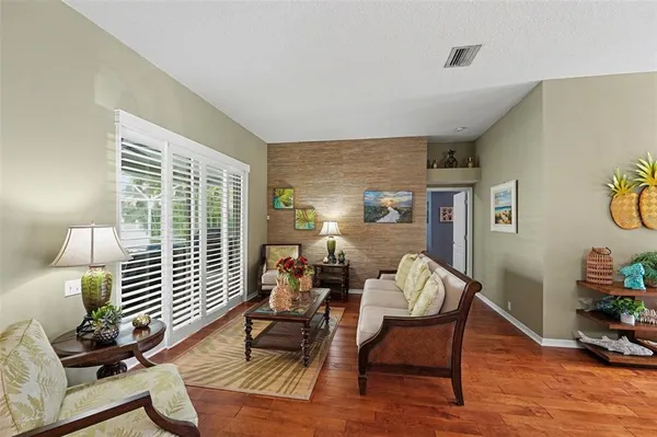 a living room with furniture and a large window