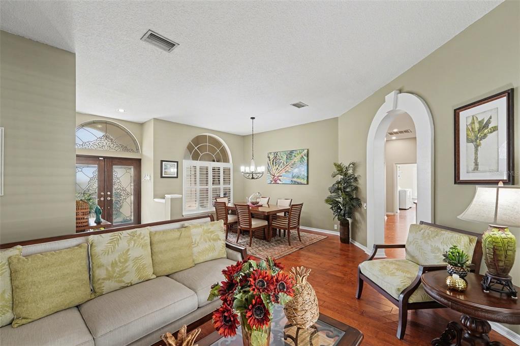 4491 Fallbrook Boulevard Palm Harbor, FL 34685 - Photo 6 of 46 a living room with furniture and a large window