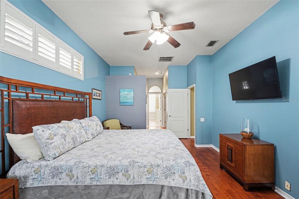 4491 Fallbrook Boulevard Palm Harbor, FL 34685 - Photo 8 of 46 a bedroom with a bed window and a flat screen television