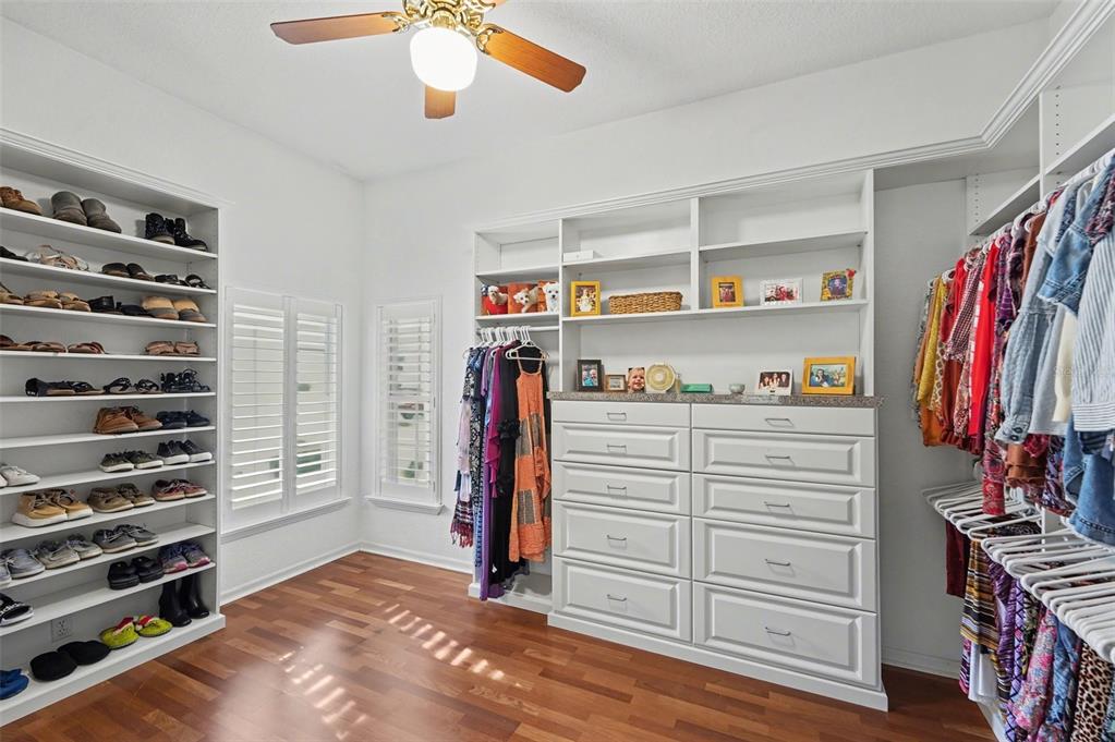 4491 Fallbrook Boulevard Palm Harbor, FL 34685 - Photo 9 of 46 a view of walk in closet with clothes and shoes