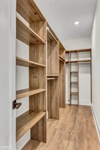 a bathroom with a double vanity sink a toilet and a mirror