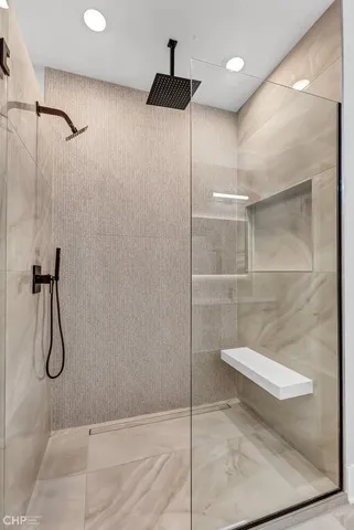 a view of a hallway with wooden floor and closet