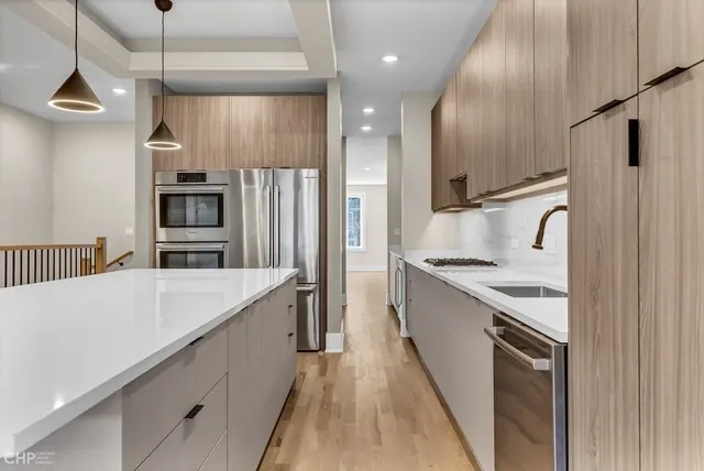 a kitchen with a sink and cabinets