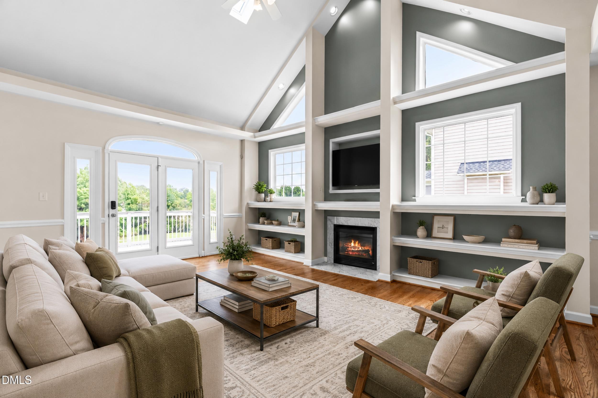 744 Seastone Street Raleigh, NC 27603 - Photo 7 of 53 a living room with furniture a fireplace and a large window